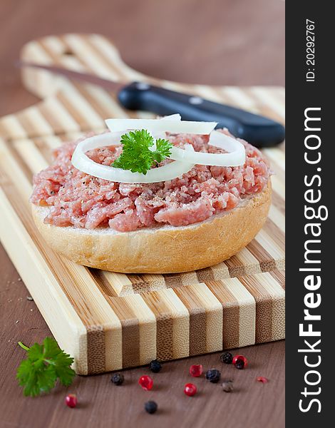Fresh bun with minced meat with onion