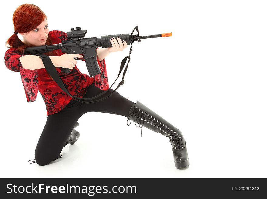 Young woman aiming Pellet Air Rifle over white background.