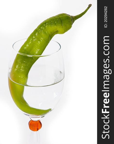 Green Chilli in Wine Glass on white background. Green Chilli in Wine Glass on white background.