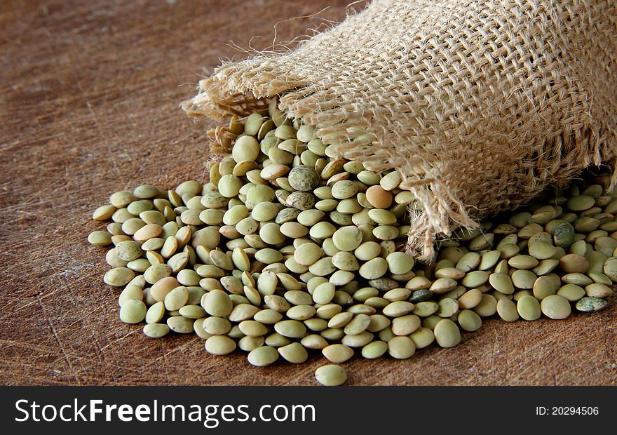 Macro view of lentils on wooden background