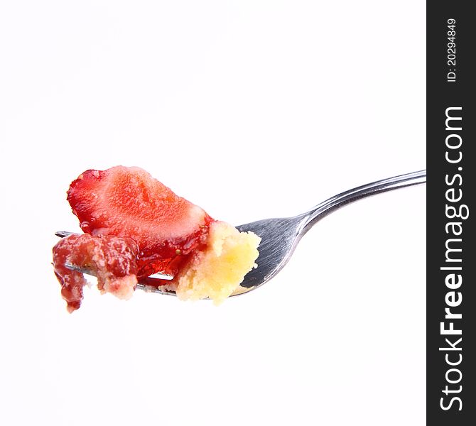 Piece of Strawberry Tart on a fork on a white background