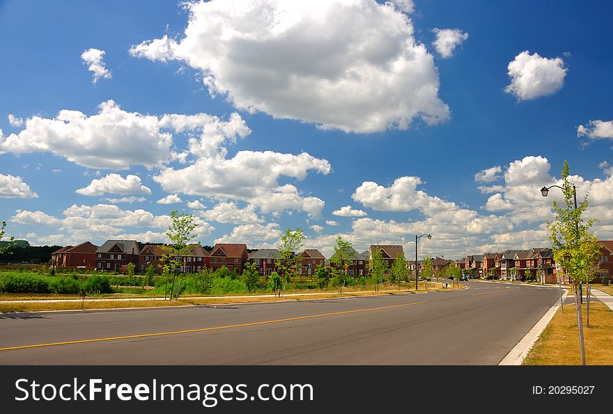 White clouds over newly developed houses