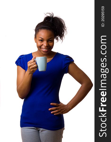 A young woman holding a mug of coffee. A young woman holding a mug of coffee.