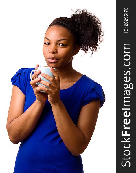 A young woman holding a mug of coffee. A young woman holding a mug of coffee.