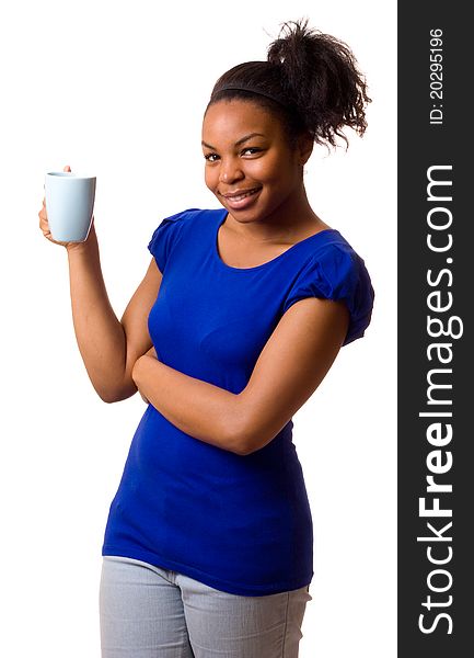 A young woman holding a mug of coffee. A young woman holding a mug of coffee.