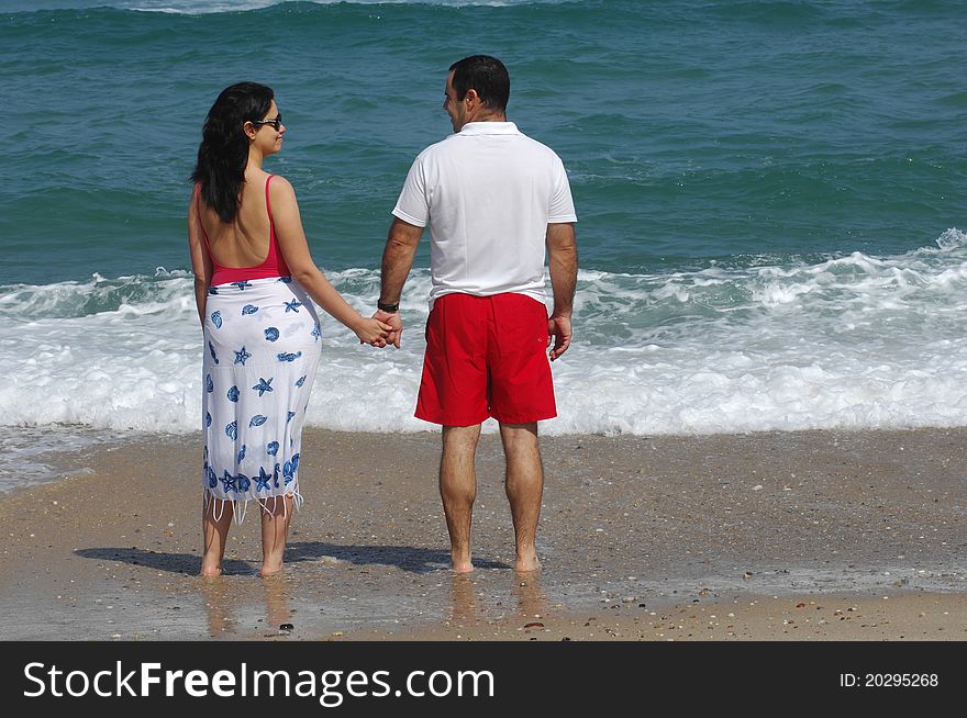 Portrait of a lovely romantic couple on the beach