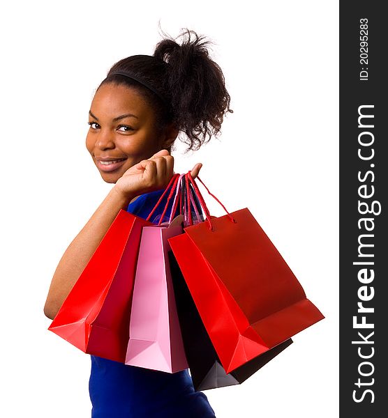 A young woman holding shopping bags isolated on a white background. A young woman holding shopping bags isolated on a white background.