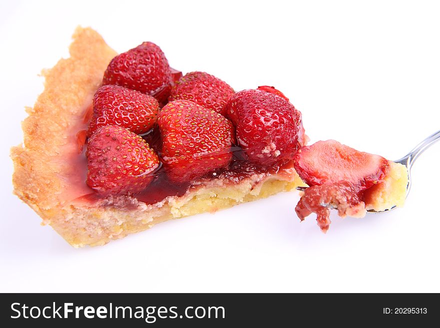 Strawberry Tart portion, a bite on a fork, on a white background