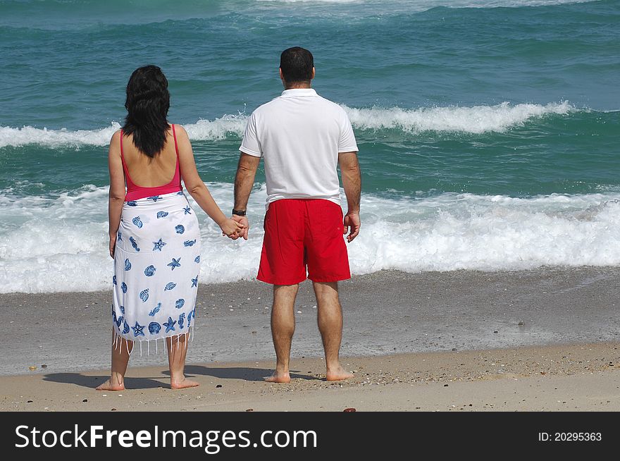 Portrait of a lovely romantic couple on the beach