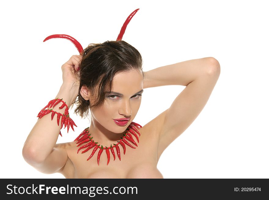 woman with jewelry and horns of red hot pepper isolated on white