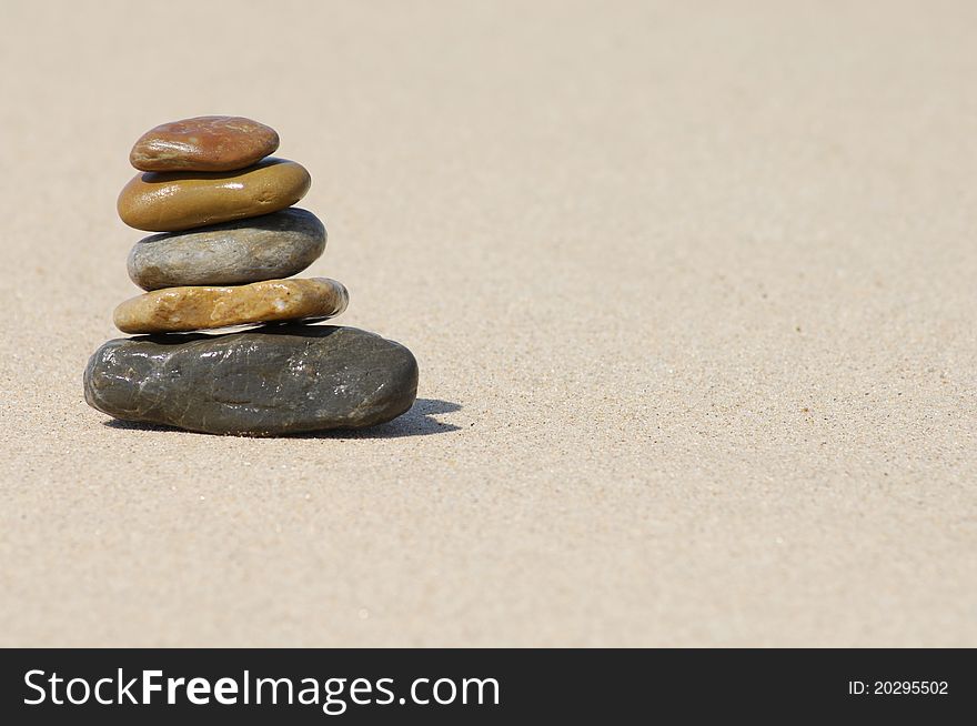 Balanced stones on beach sea coast