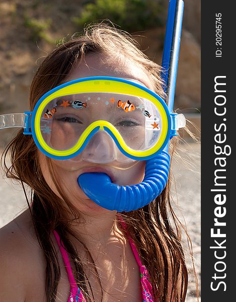 Little girl wearing mask and snorkel for diving. Little girl wearing mask and snorkel for diving