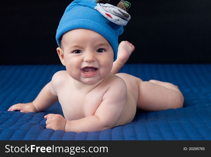 Closeup portrait of cute smiling baby boy