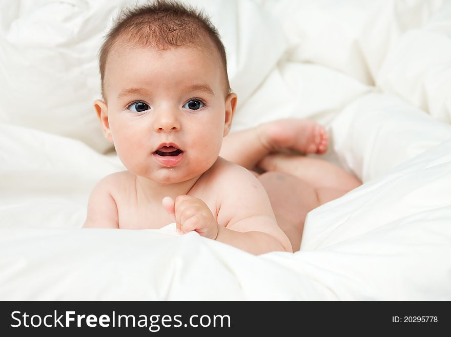 Closeup portrait of cute smiling baby boy