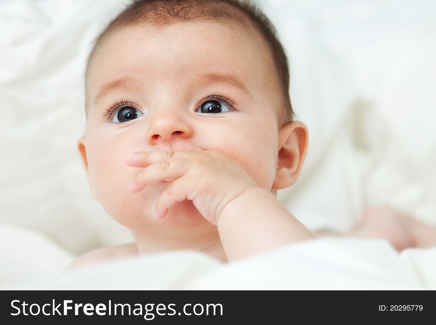 Closeup Portrait Of Cute Smiling Baby Boy