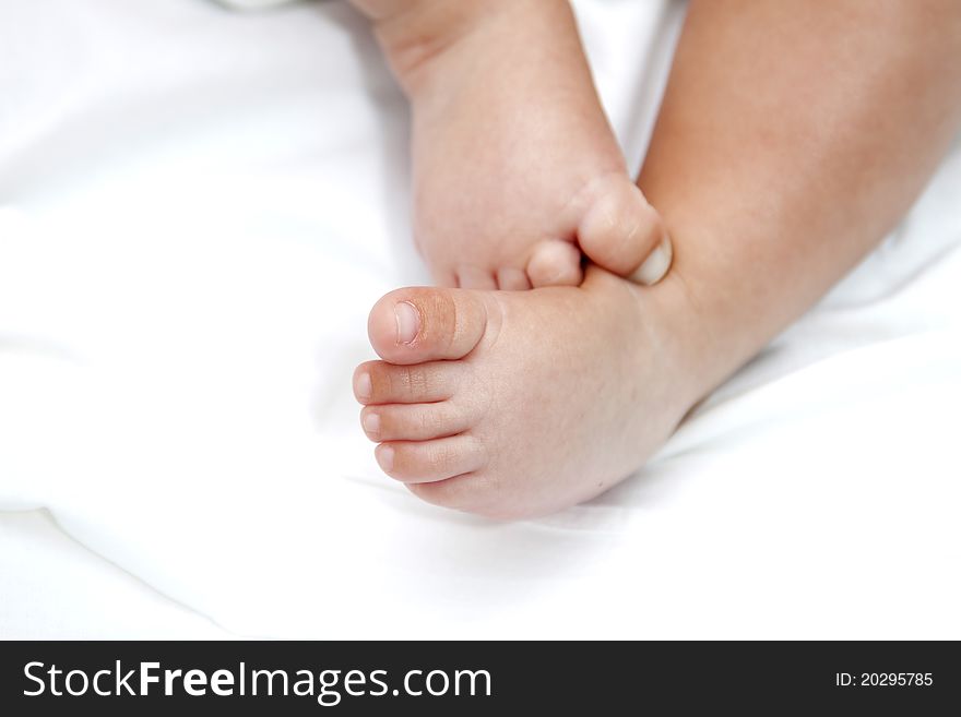 Baby legs isolated on white