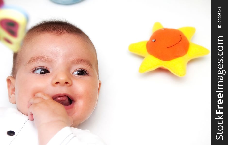 Closeup portrait of cute smiling baby boy