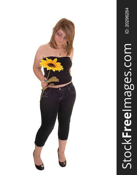 Teen holding sunflower.