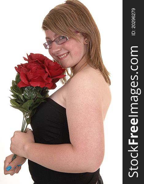 Smiling teenager holding a bunch of red roses to her chest, smiling into the camera, in closeup and with glasses, for white background. Smiling teenager holding a bunch of red roses to her chest, smiling into the camera, in closeup and with glasses, for white background.