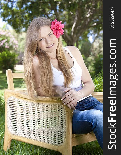 Portrait of a beauty blonde girl outdoor in a park