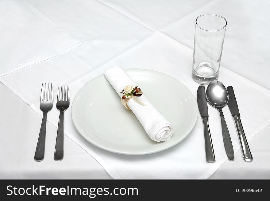 Celebration table with basic cutlery and glass prepared