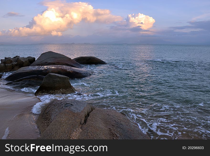 Rocky sea coast under sunset, shown as featured physiognomy and landscape.