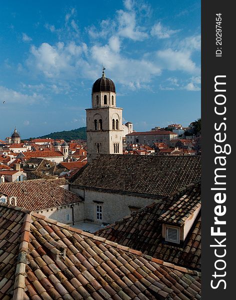 A view of Dubrovnik rooftops against blue sky at sunset