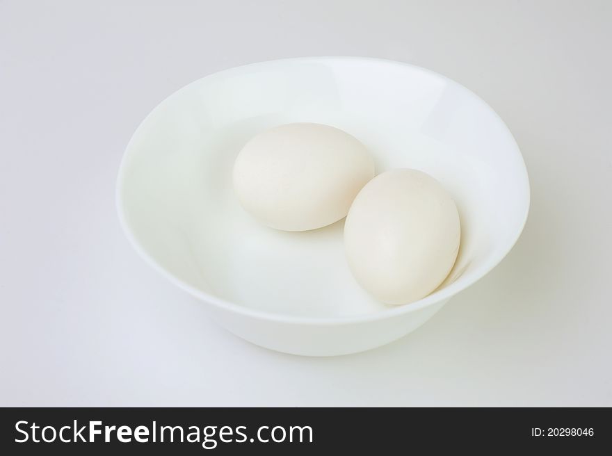 An image of two white eggs in a bowl