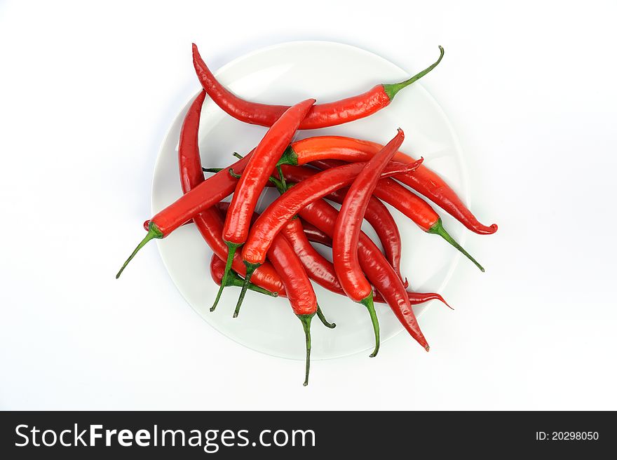 An image of red peppers in white bowl. An image of red peppers in white bowl