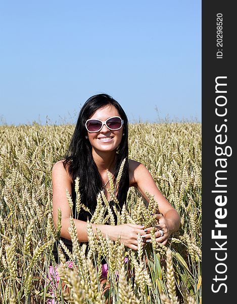 Young attractive girl in wheat field. Young attractive girl in wheat field