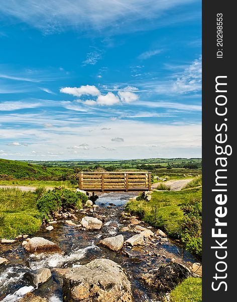 A wooden footbridge on Carrock Beck, Cumbria, in the English Lake District National Park. A wooden footbridge on Carrock Beck, Cumbria, in the English Lake District National Park