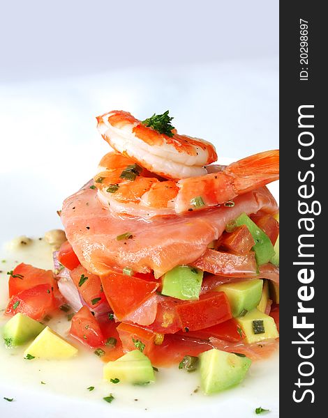 King prawns with smoked salmon, over an avocado salsa. King prawns with smoked salmon, over an avocado salsa.