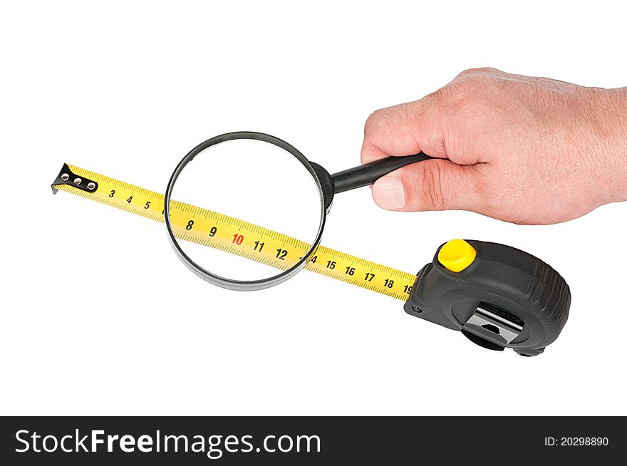 Measuring tool a roulette and magnifier in hand isolated on white background. Measuring tool a roulette and magnifier in hand isolated on white background