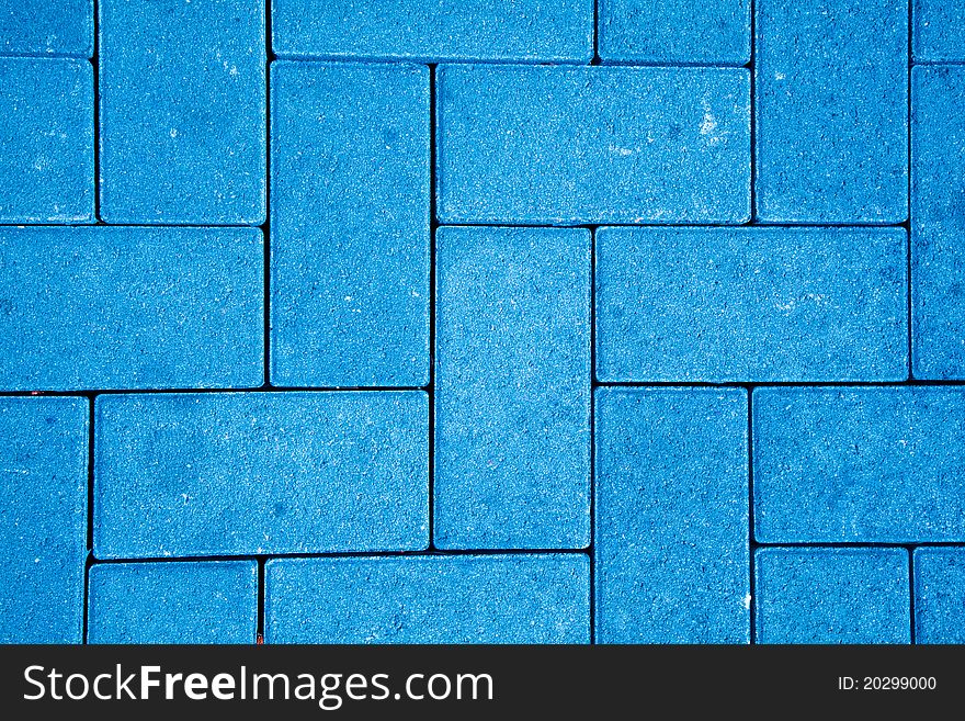 Pavement pattern made with cast concrete blocks in blue color