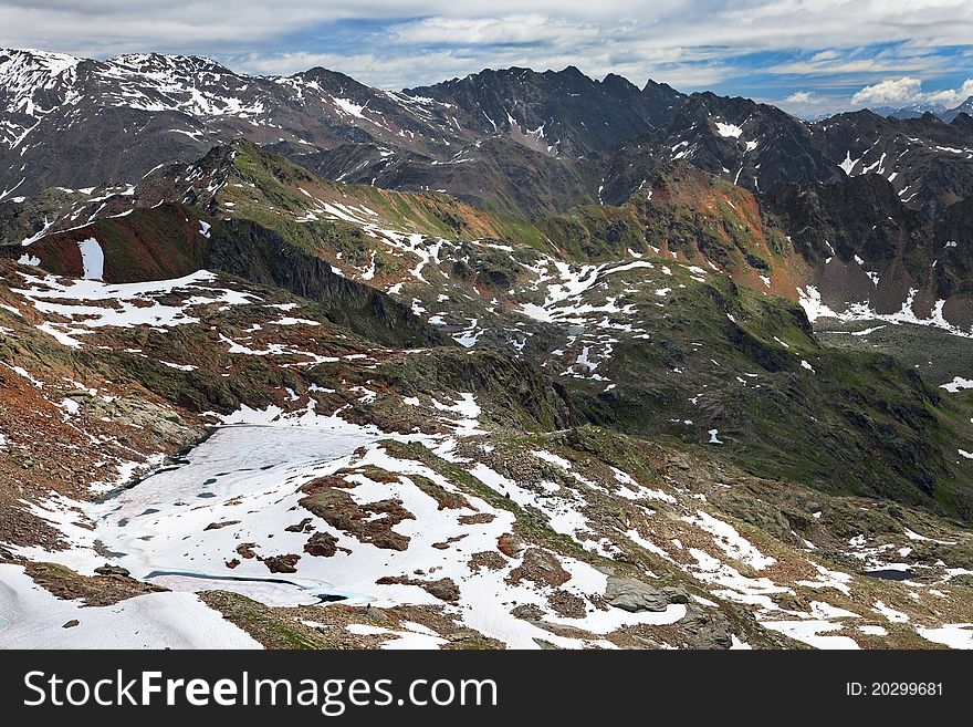 Small icy mountain lakes after a frozen night during summer. Small icy mountain lakes after a frozen night during summer