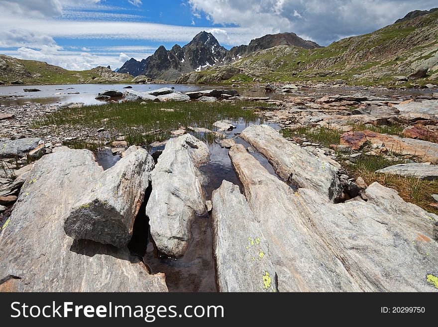 Small icy mountain lakes after a frozen night during summer. Small icy mountain lakes after a frozen night during summer