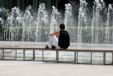 Yong Man And Fountain Stock Photography
