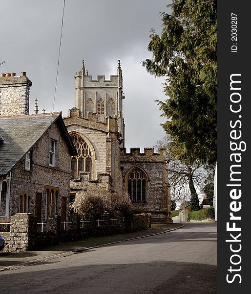 English Village Street with Medieval Church and Houses