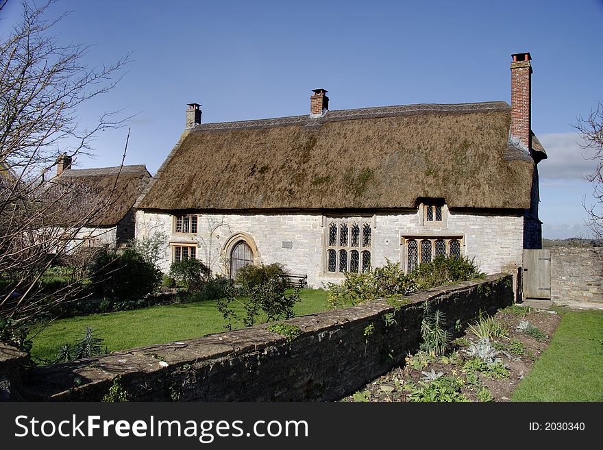 Thatched natural stone Medieval House in Rural England. Thatched natural stone Medieval House in Rural England