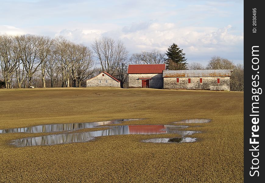 A view of a colorful farm and a large reflecting puddle in Holmdel New Jersey. A view of a colorful farm and a large reflecting puddle in Holmdel New Jersey.