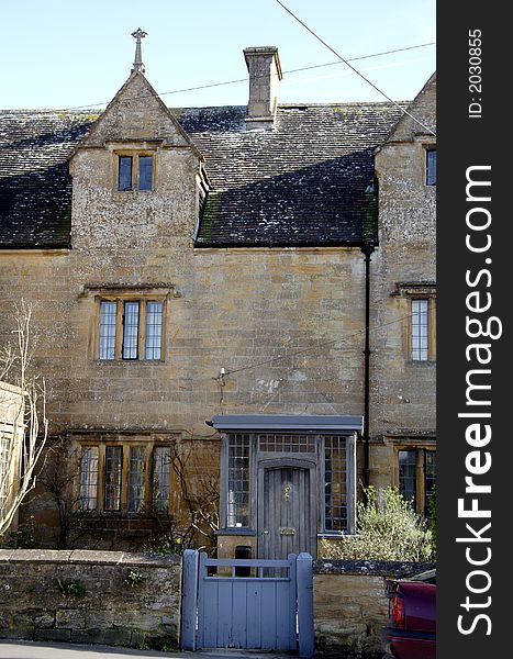 Winter sunshine on a Natural Stone Mullion windowed English Village House