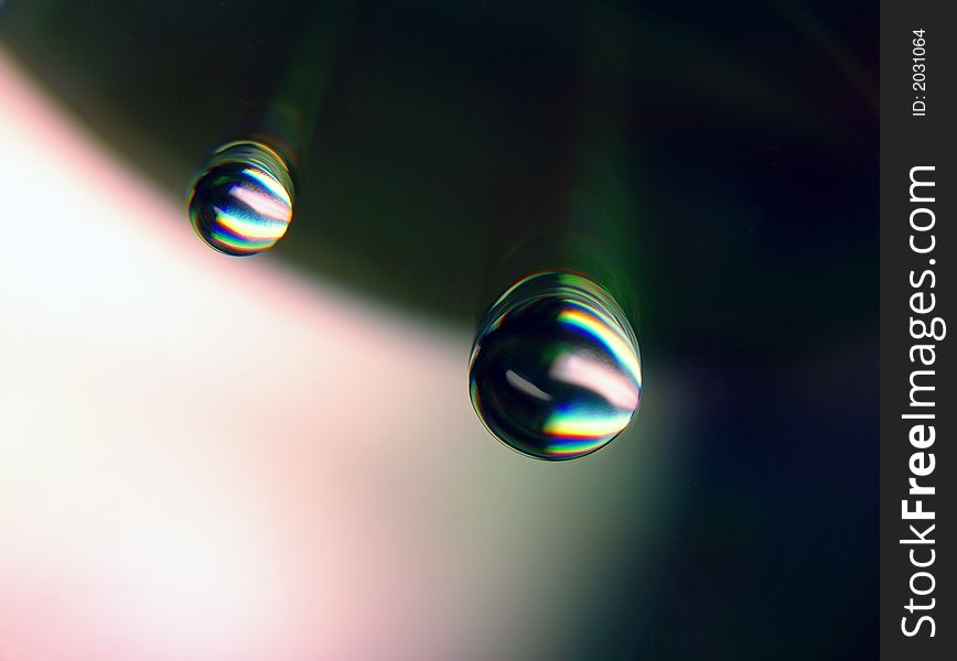 Drops of water on a compact disc. Drops of water on a compact disc