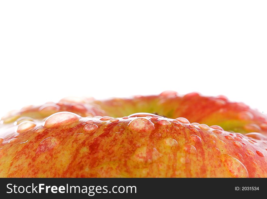 Water drops on the apple over white