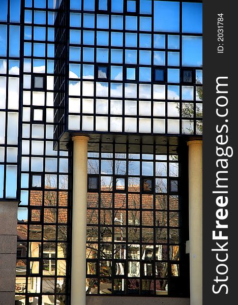 Reflections in blue windows.Modern buildings.