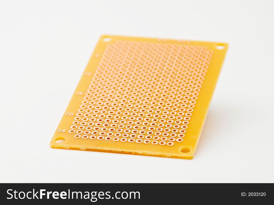 Perforated circuit board isolated on white background. Perforated circuit board isolated on white background