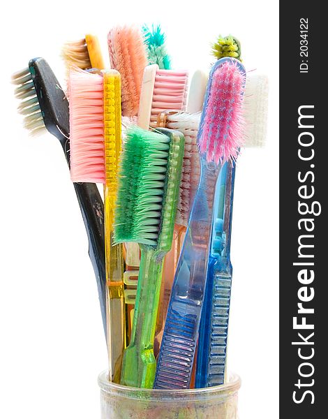 Old toothbrushes used for creative artwork. Isolated on white background. Old toothbrushes used for creative artwork. Isolated on white background.