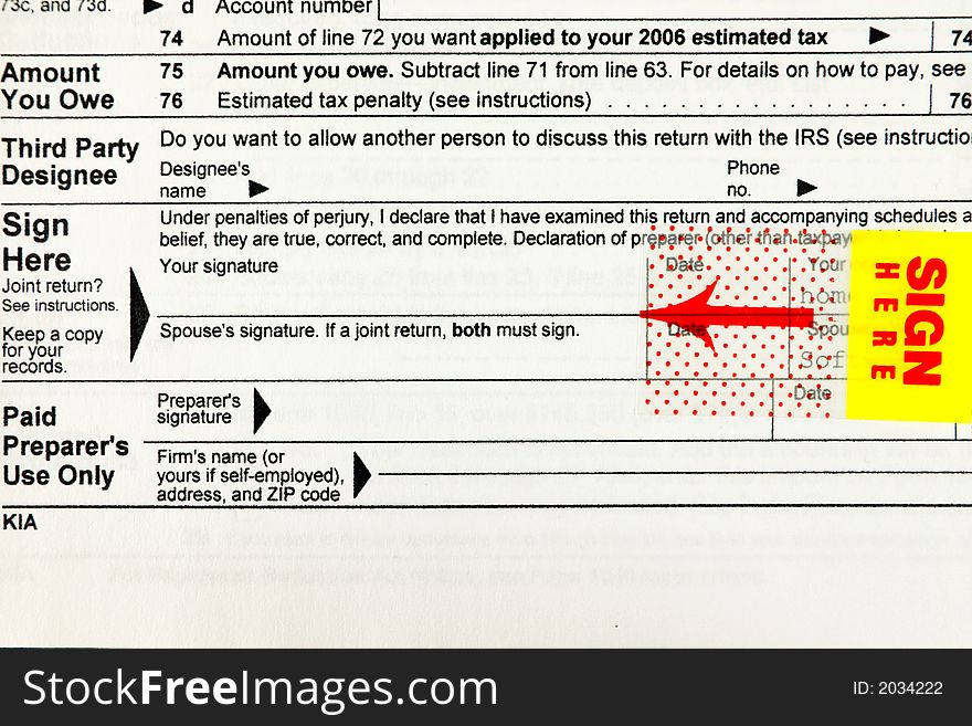 Sign here - IRS Tax form closeup