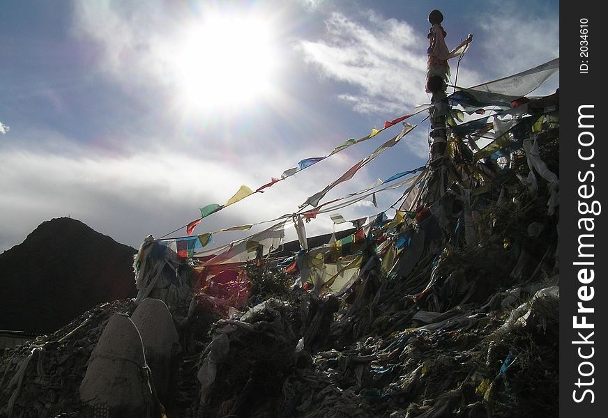 A holy site on the mountain covered wit prayer flags. A holy site on the mountain covered wit prayer flags