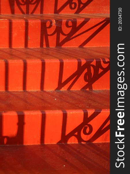 Evening shadows on red stairs. Evening shadows on red stairs