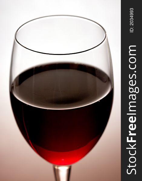 The close up of the red wine glass